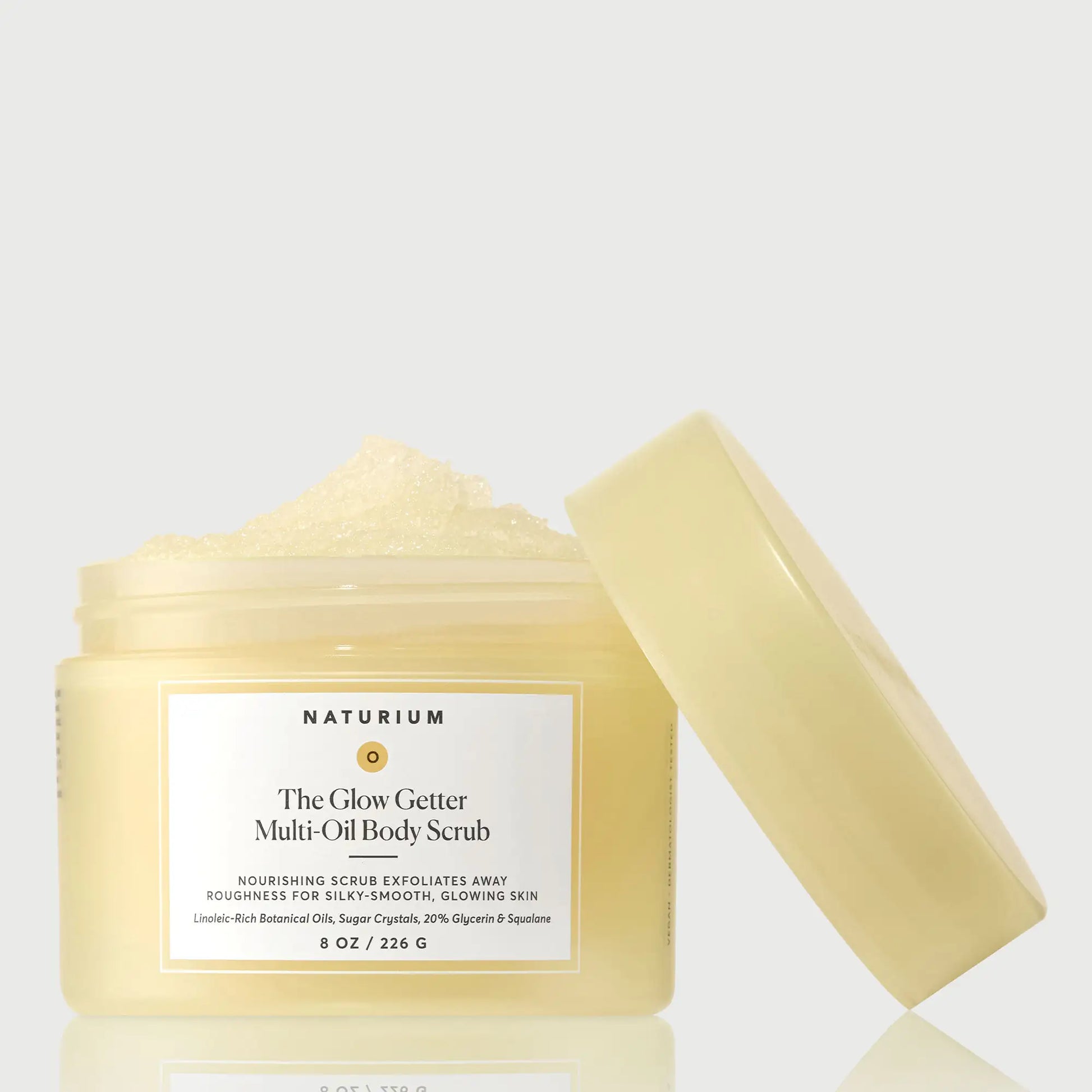 the-glow-getter-multi-oil-body-scrub-u0 NATR-40028-GlowGetter-Multi-Oil-Body-Scrub-Front-CapOff-bonebkgd.webp