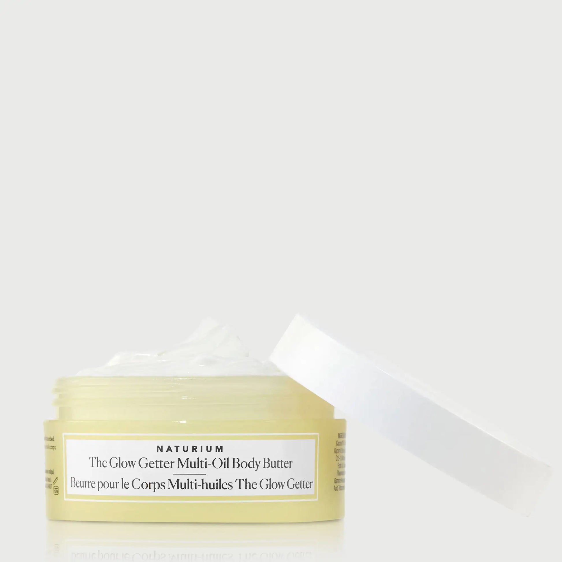 the-glow-getter-multi-oil-body-butter-travel-size-e2 NATR-40115_Glow-Getter-Body-Butter-Mini_front_capoff_bonebkgd.webp